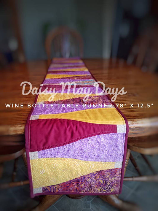 Colorful scrappy Quilted Table Runner: Wine bottle patchwork design, Hand-crafted